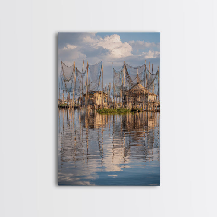 Sunlit Stilt Fishing Huts And Net Reflections Wall Art, Coastal Lake Village Canvas Print, Serene Blue Water Living Room Decor