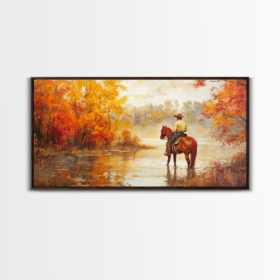 Cowboy sitting by campfire near a lake in the woods with autumn leaves, Framed Canvas Print, moody fall wall art, rustic western home decor