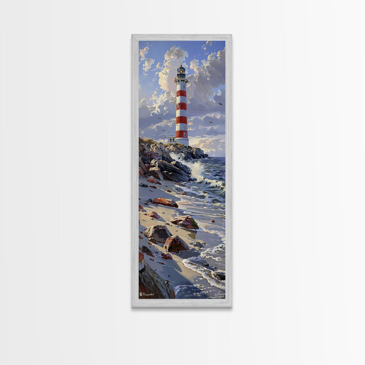 Framed Canvas Print Skinny Art of a Majestic Lighthouse Standing Tall Against a Bright Blue Sky with Waves Crashing on Rocky Shores, Perfect Tall Art