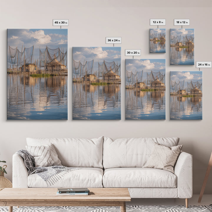 Sunlit Stilt Fishing Huts And Net Reflections Wall Art, Coastal Lake Village Canvas Print, Serene Blue Water Living Room Decor
