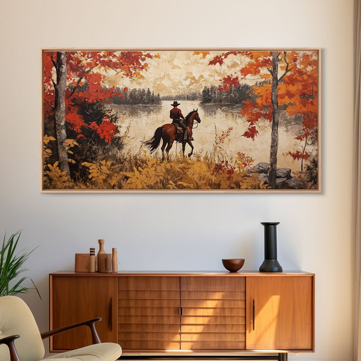 Cowboy on mountainside with red autumn leaves rugged cliffs, Framed Canvas Print, fall landscape wall art, western decor with warm colors