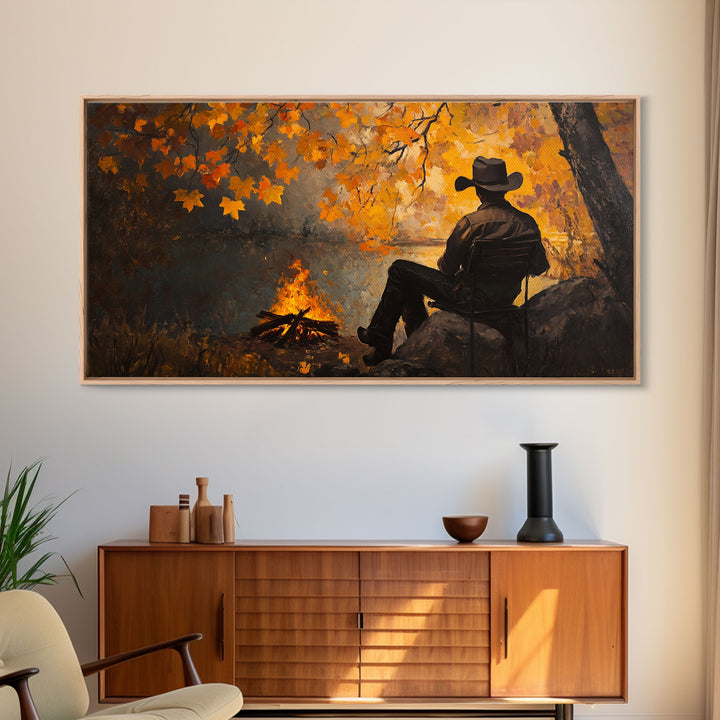 Cozy autumnal Framed Canvas Print featuring a woman with a mug, surrounded by vibrant fall leaves, perfect seasonal wall art for cozy spaces