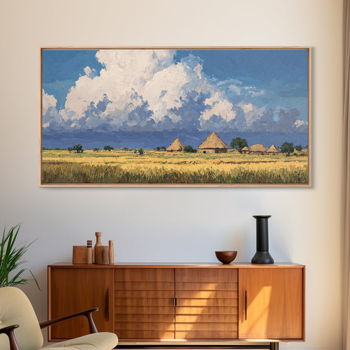 Thatched Village Under White Clouds Canvas Print, African Landscape, Rustic Decor, Cultural Wall Decor, Living Room Art Gift