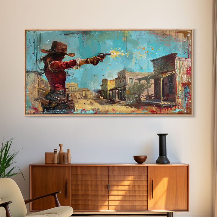 Framed Canvas Print Featuring Western Woman Shooting Revolver in Colorful Town, Ideal for Living Room Wall Art, Bedroom Decor