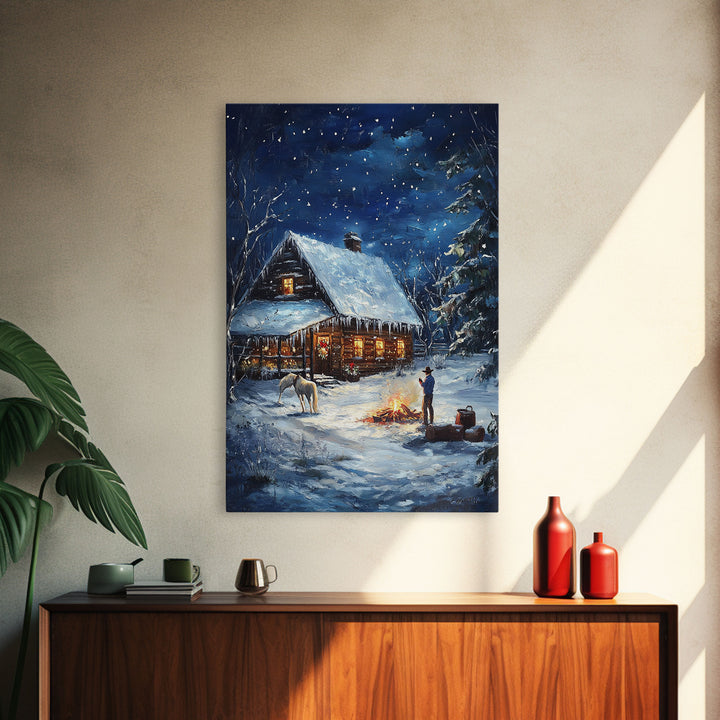 Cowboy Christmas by the Fire Framed Canvas Print, Western Holiday Decor with Snowy Cabin, Cozy Art Perfect for Rustic Christmas Winter Decor