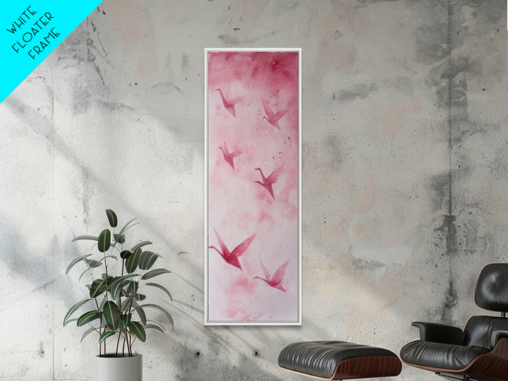 Crane Flight Canvas Print, ethereal origami bird painting in pink abstract hues, tall narrow wall art with zen minimalist aesthetic.