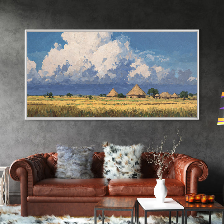 Thatched Village Under White Clouds Canvas Print, African Landscape, Rustic Decor, Cultural Wall Decor, Living Room Art Gift